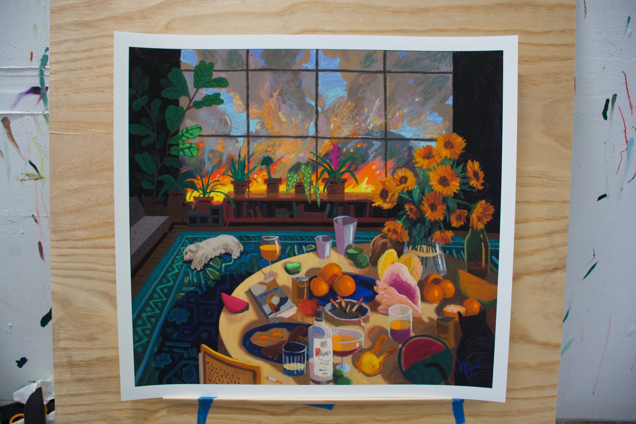 Framed artwork of a colorful interior scene with a table, flowers, and a dog.