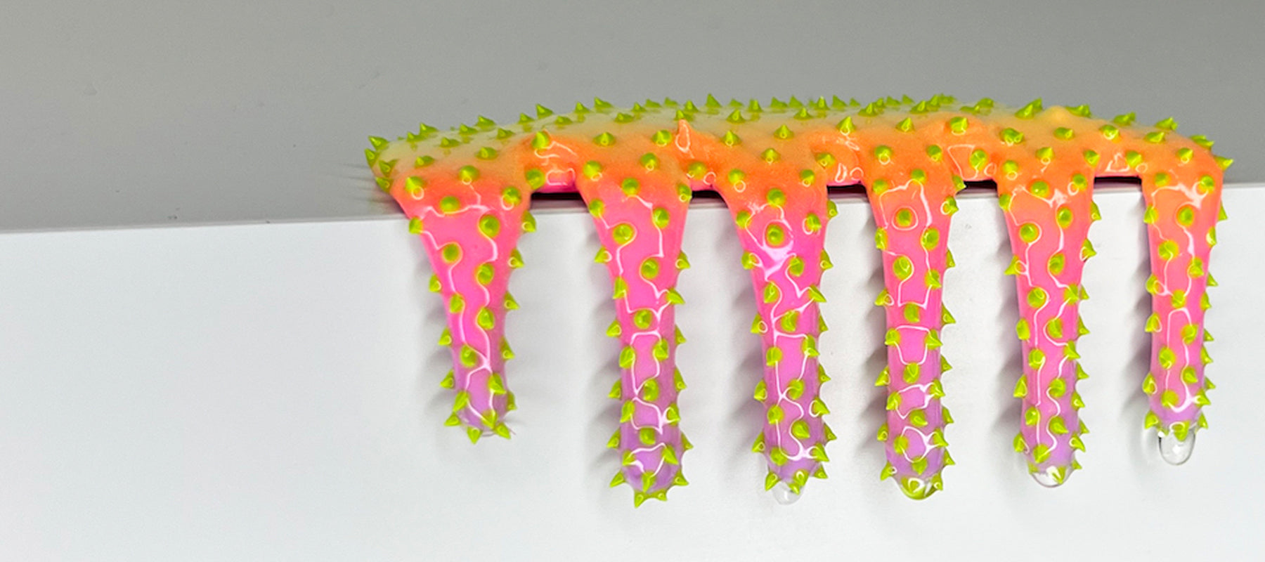 Dan Lam mini slime drip in pink and orange