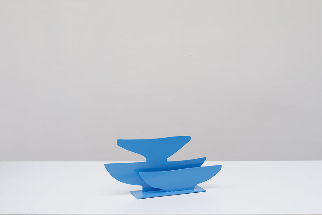 Steel sculpture of three blue bowls