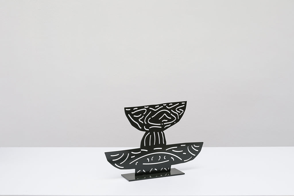 Steel sculpture of two black bowls