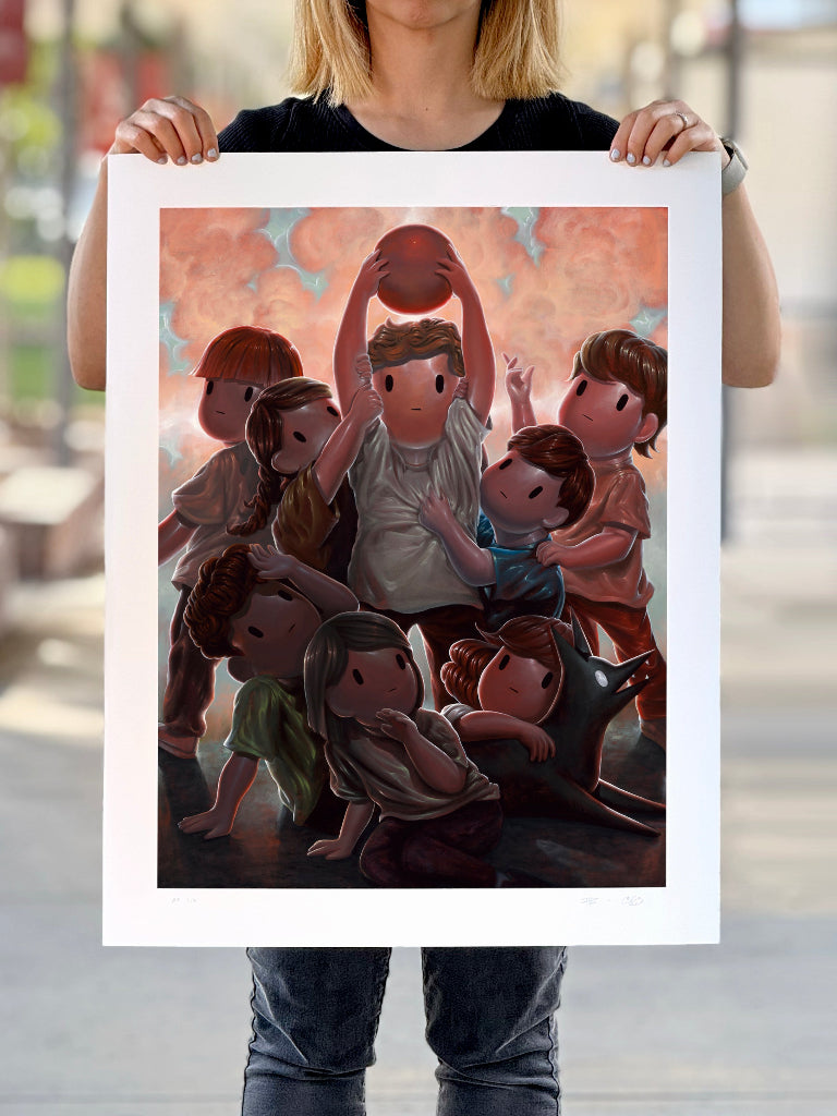 Person holding a print of children playing dodgeball